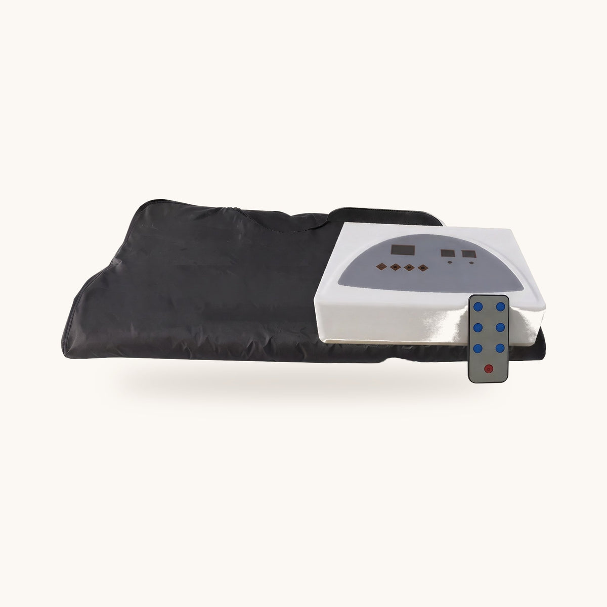 Couverture sauna infrarouge noire pliée, boîtier de commande et télécommande, sur fond ivoire